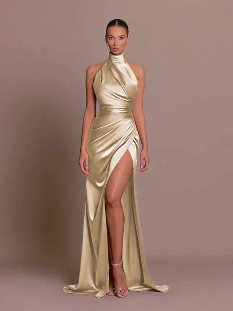 Party-ready women's bodycon halter neck ruched maxi dress, designed with a sophisticated high split detail.