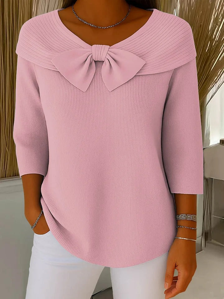 Flattering fit women's sweater with elegant bow detail for a chic, versatile look.