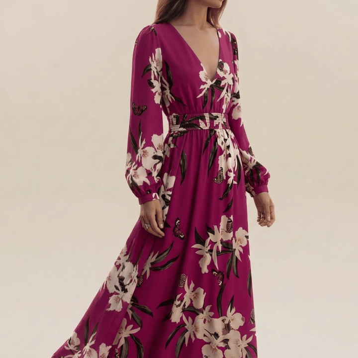 Flowy women's floral maxi dress with long sleeves & V-neck, ideal for comfortable fashion and seasonal elegance.