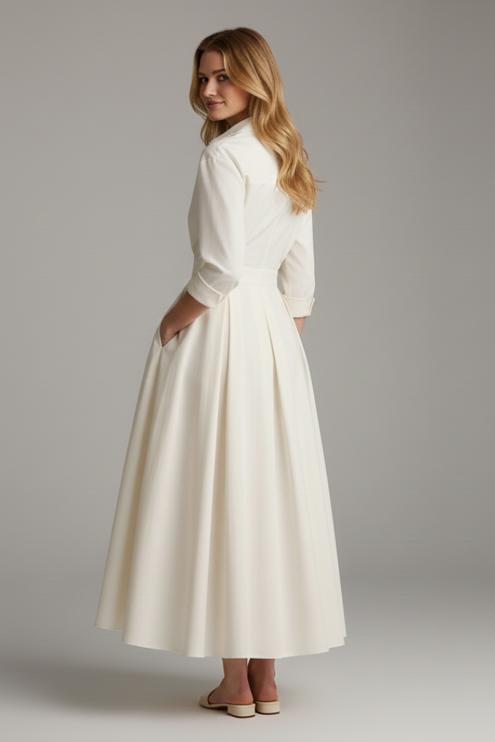 Stylish women's midi dress with a full button front, long sleeves, & defined waist. Flared skirt adds elegance.