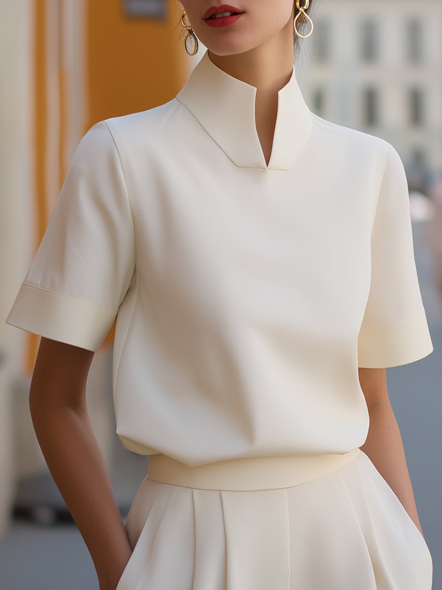 Women's elegant mandarin collar blouse, short sleeve, relaxed fit for office or casual wear.