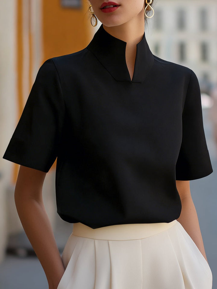 Elegant women's relaxed fit short sleeve blouse with mandarin collar, sophisticated and comfortable.
