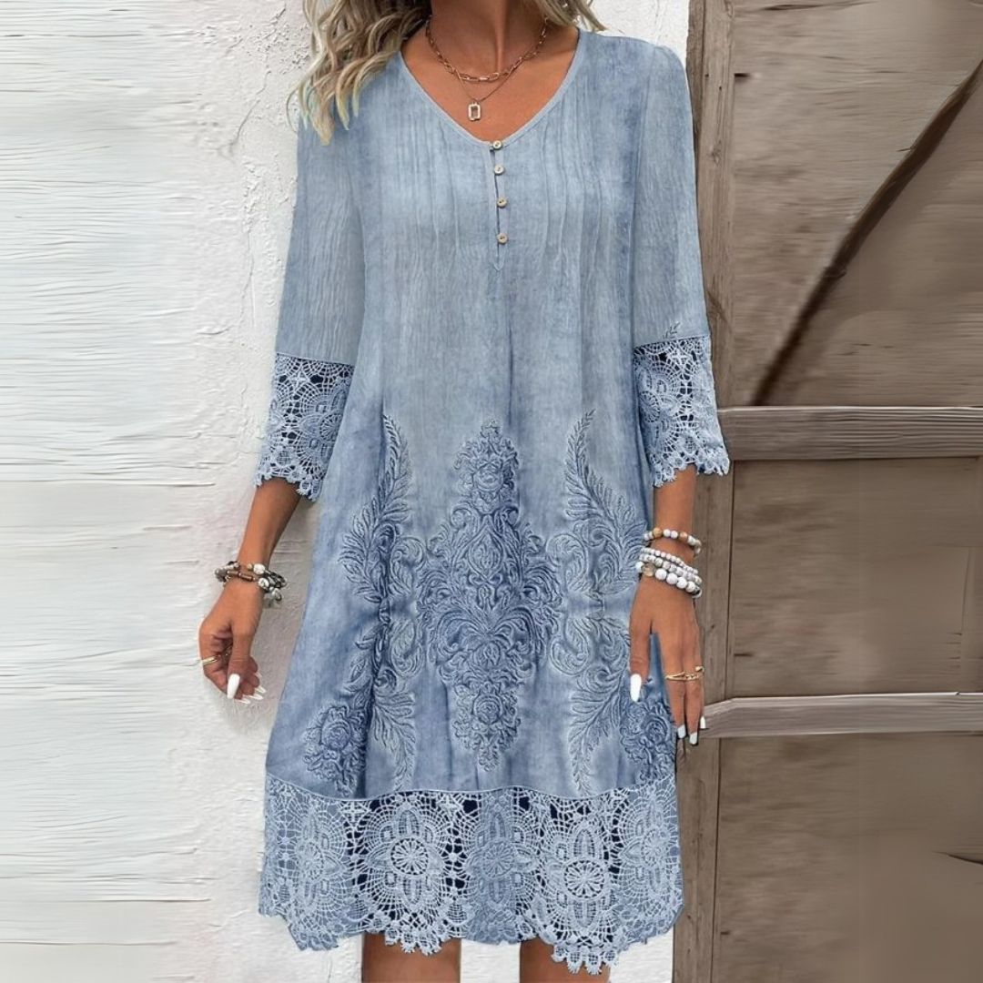 Women's elegant midi shift dress with beautiful lace details and practical three-quarter sleeves, perfect for day wear.
