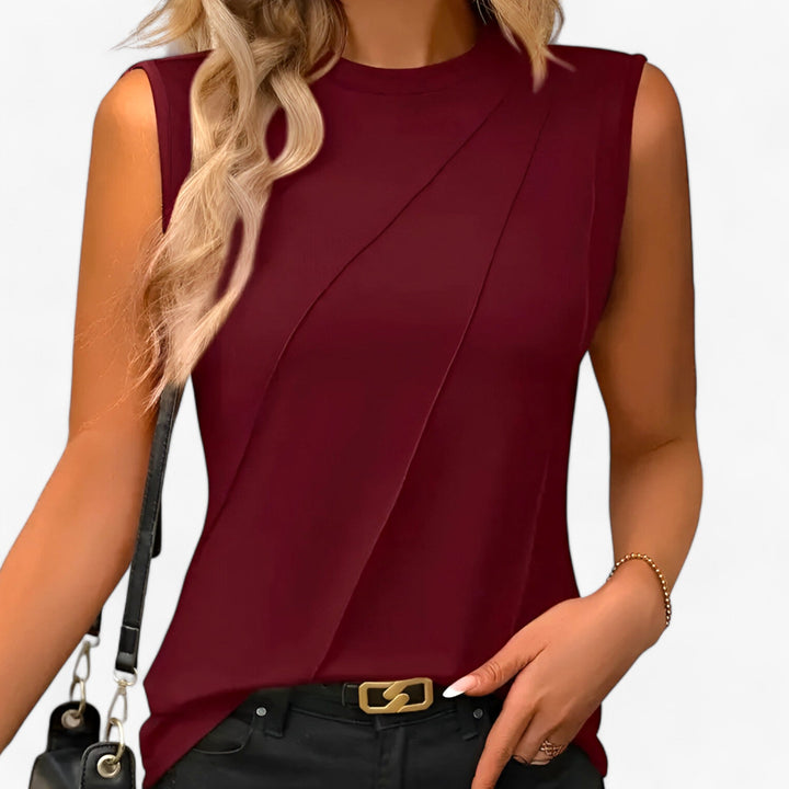 Chic women's mock neck sleeveless blouse with a beautiful draped, flowing design, great for any occasion.