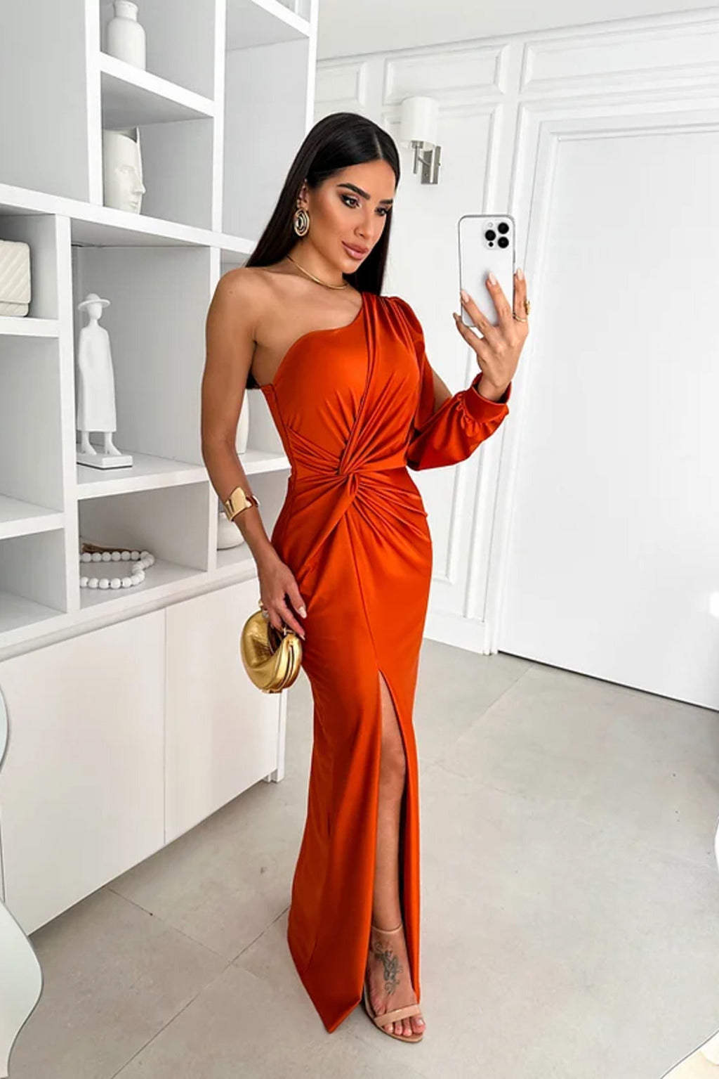 Metallic silver one-shoulder wedding guest dress, elegant and modern formal wear.
