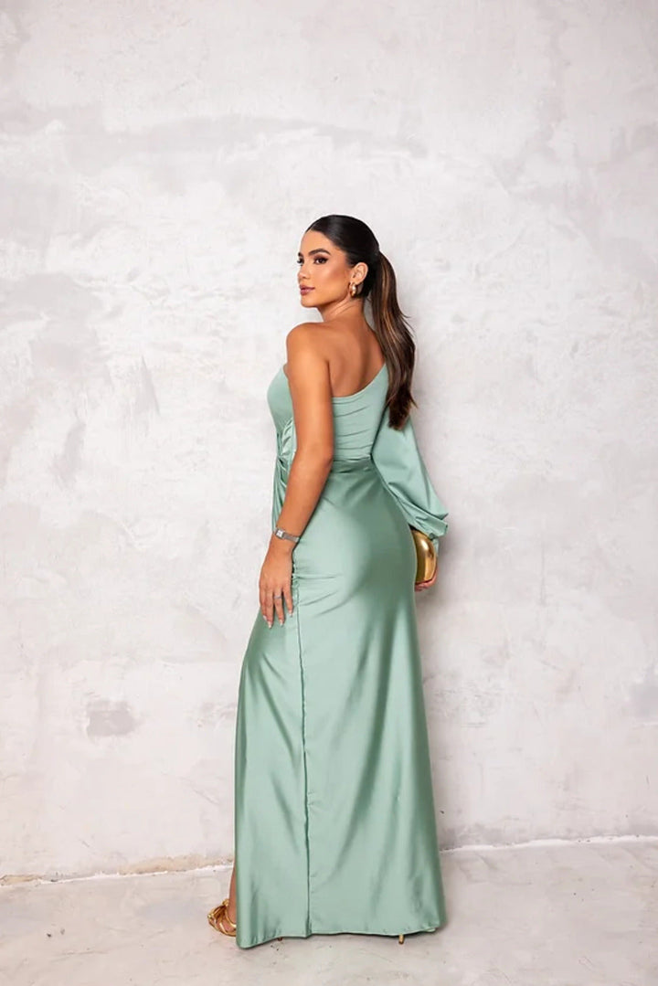 Luxurious emerald green one-shoulder special occasion gown, a beautiful wedding guest dress.