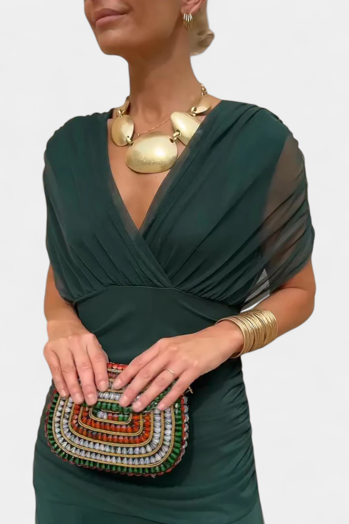 Women's elegant off-shoulder ruched midi dress, ideal for special occasions.