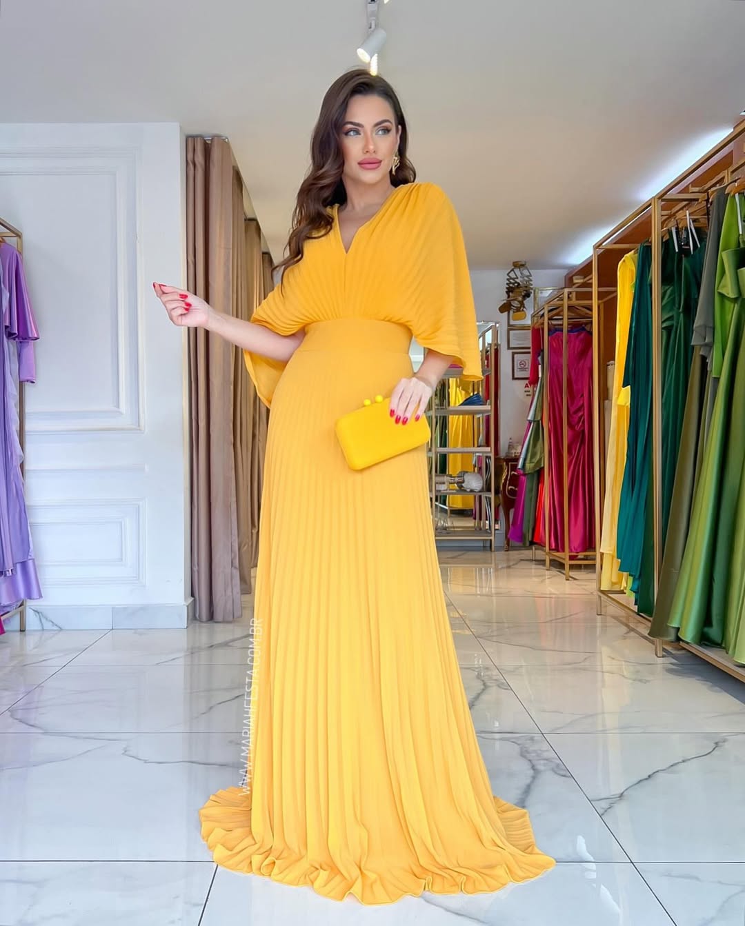 Beautiful women's pleated batwing maxi dress for wedding guests. Elegant V-neck formal evening or special occasion wear.