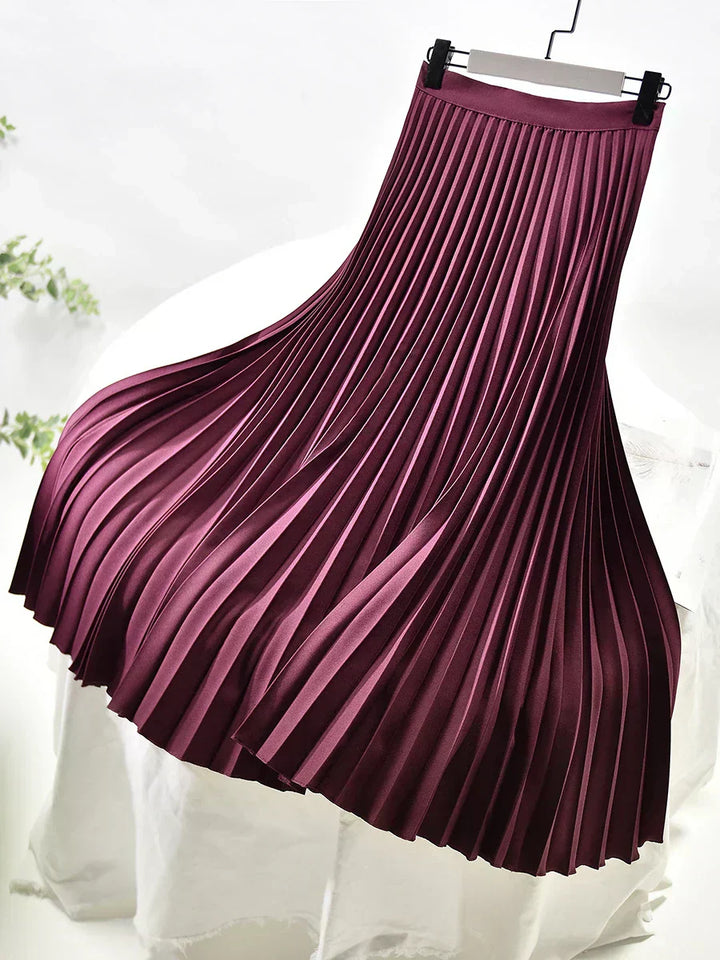Detail of the fabric and pleats on a women's apparel skirt, demonstrating its quality and style.