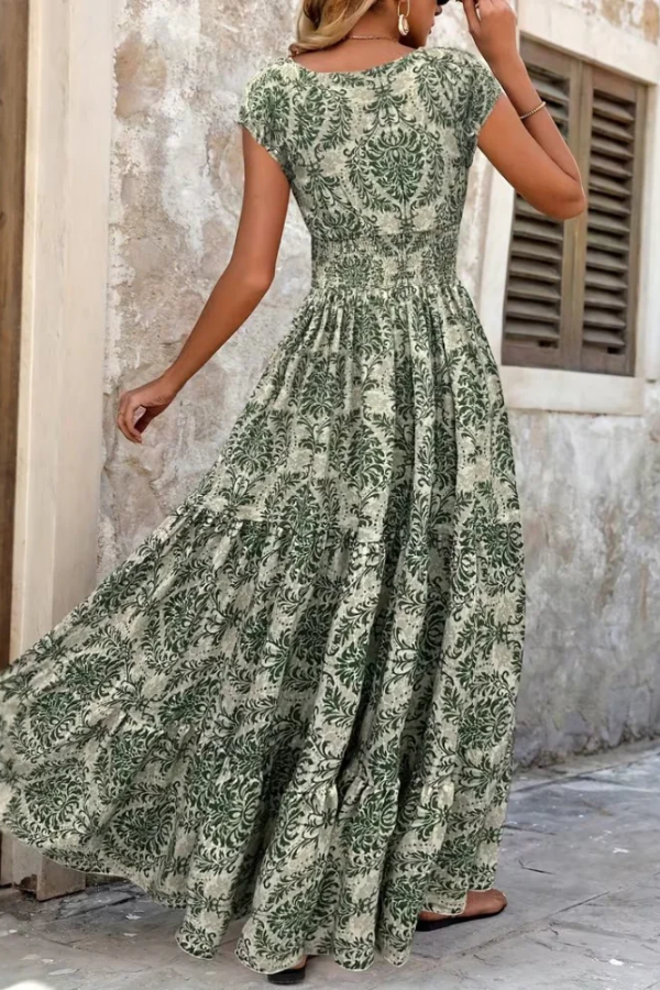Women's elegant printed V-neck maxi dress, perfect for summer vacation. Effortless flowing style for casual or dressy occasions.