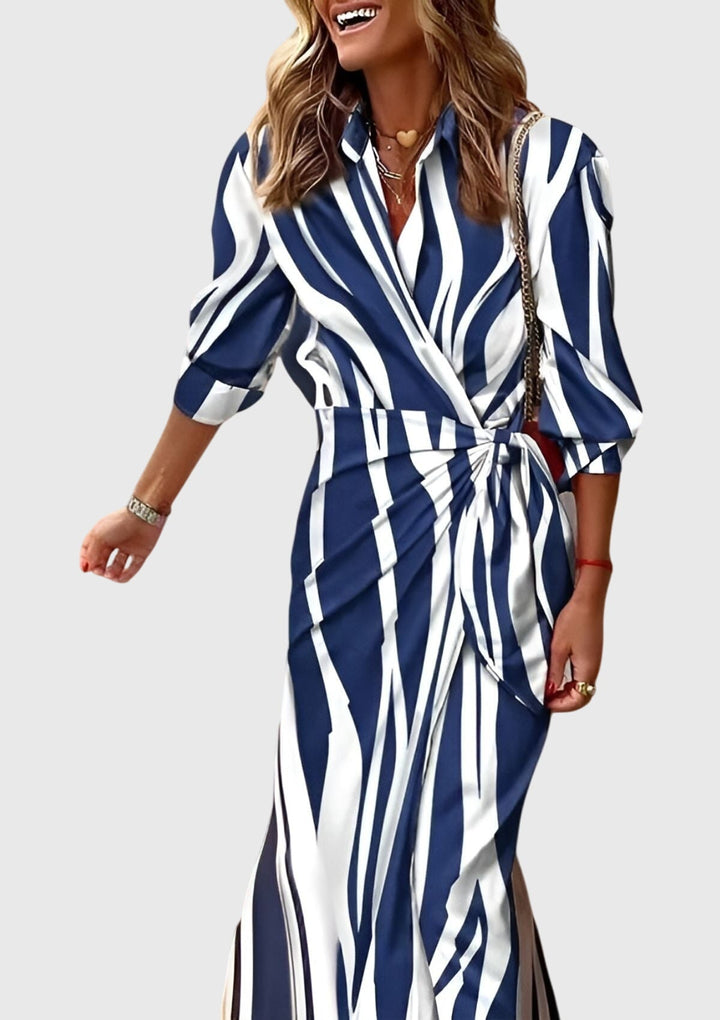 Chic women's long sleeve printed wrap midi dress. Elegant, flattering, and versatile, ideal for a stylish day to night look.