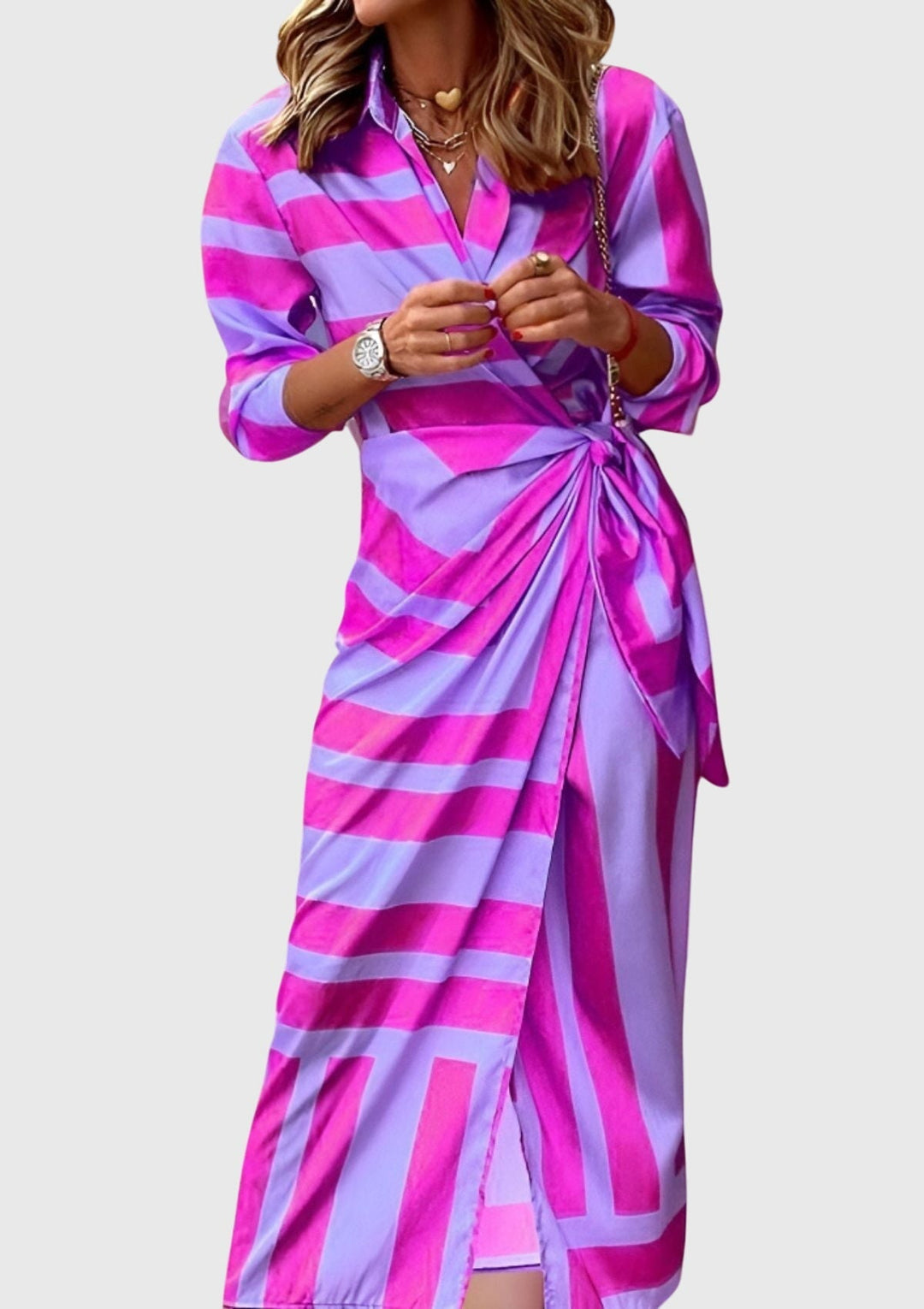 Elegant women's long sleeve wrap midi dress in a modern print. Chic and flattering for versatile day-to-night style.