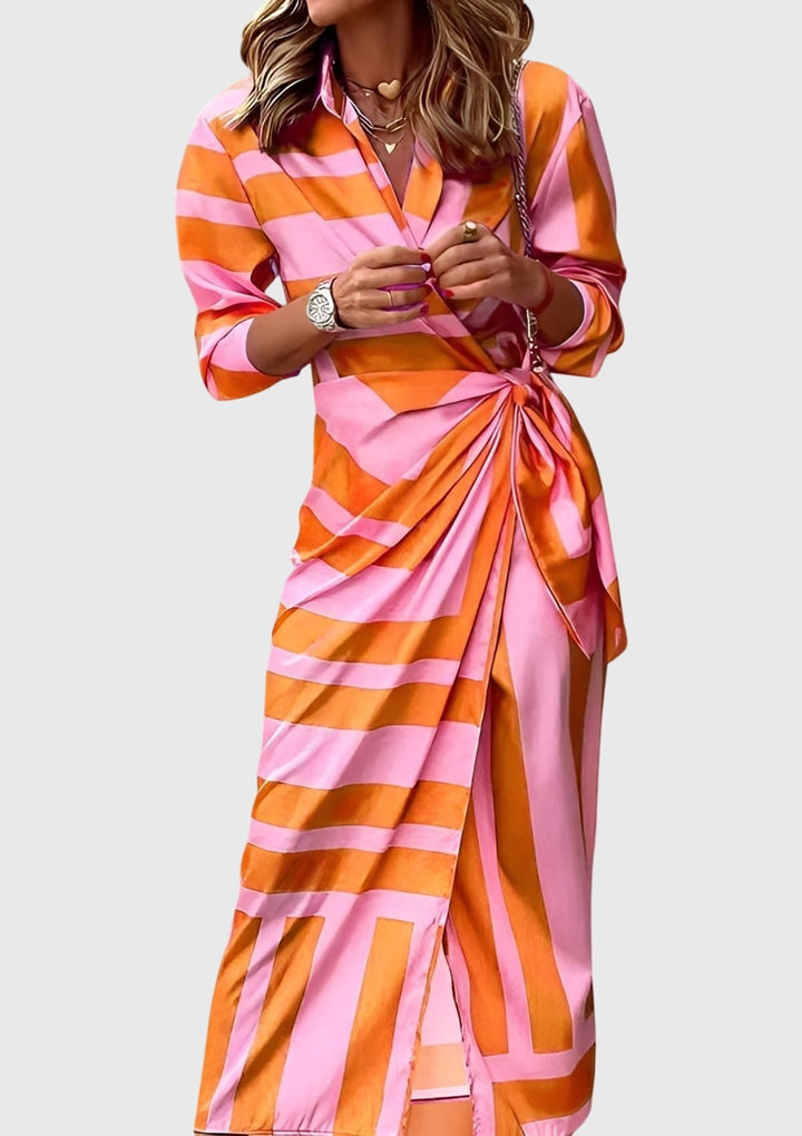 Chic women's long sleeve wrap dress with elegant print. Adjustable tie offers a flattering, versatile fit.