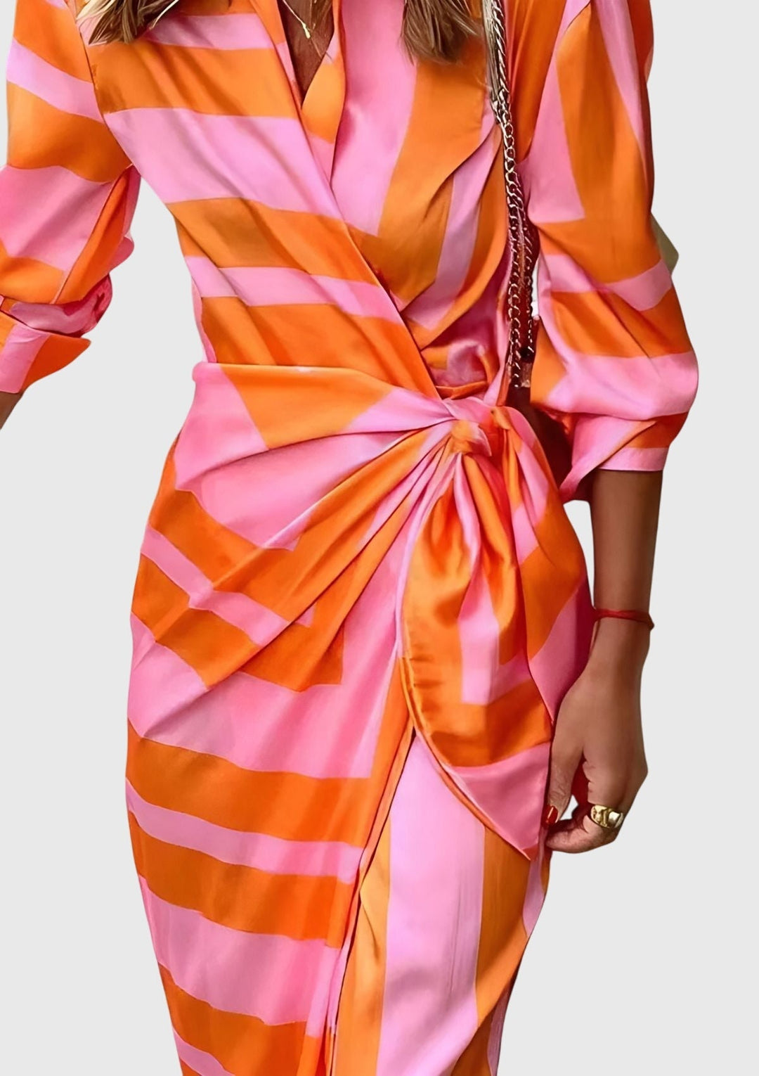 Flattering women's long sleeve wrap dress with an elegant modern print. Midi length, perfect for spring/summer outfits.