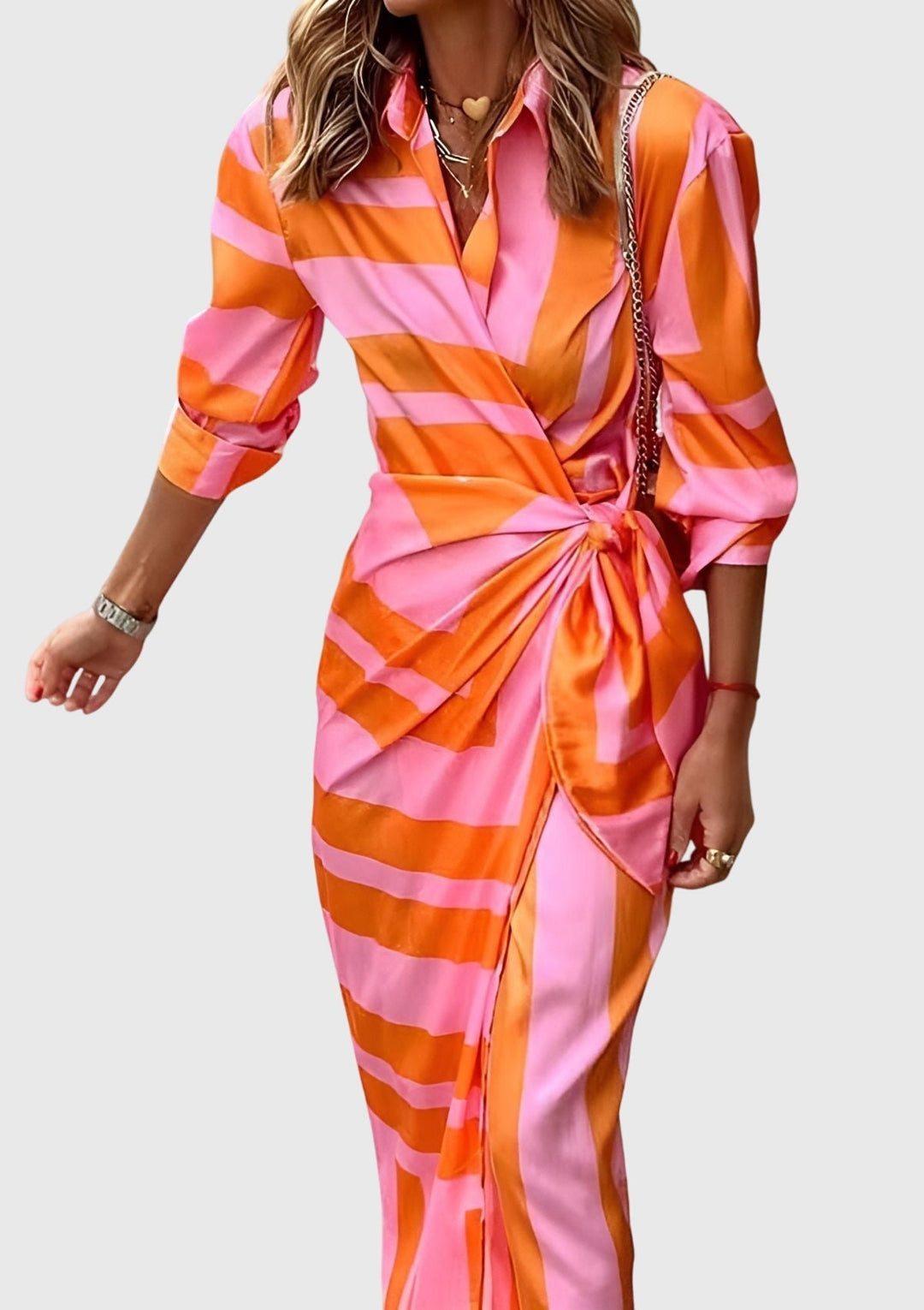 Day to night women's elegant printed wrap dress. Flattering midi length, long sleeves, and modern print for versatile wear.