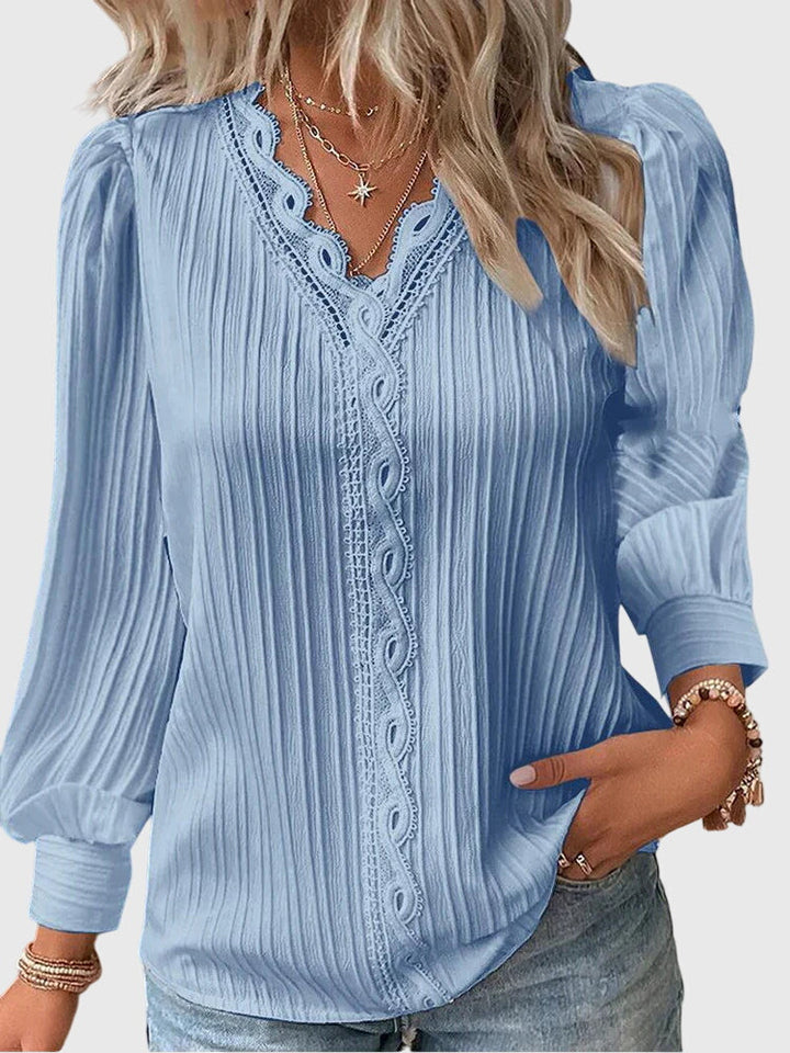 Classic women's elegant pullover blouse, a stylish long sleeve top for sophisticated everyday fashion.