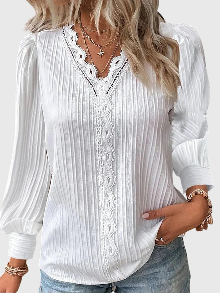 Stylish women's elegant long sleeve pullover blouse, ideal for office or sophisticated casual wear.