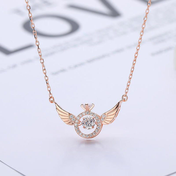 Stylish women's angel wing necklace in lustrous rose gold titanium steel, a timeless jewelry piece.