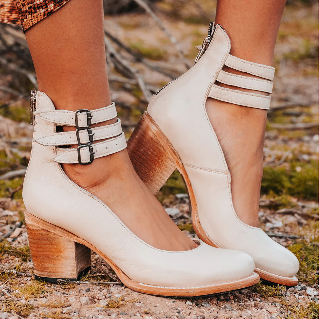 Elegant women's ankle strap block heel pumps. The classic round toe design offers both style and walking comfort.
