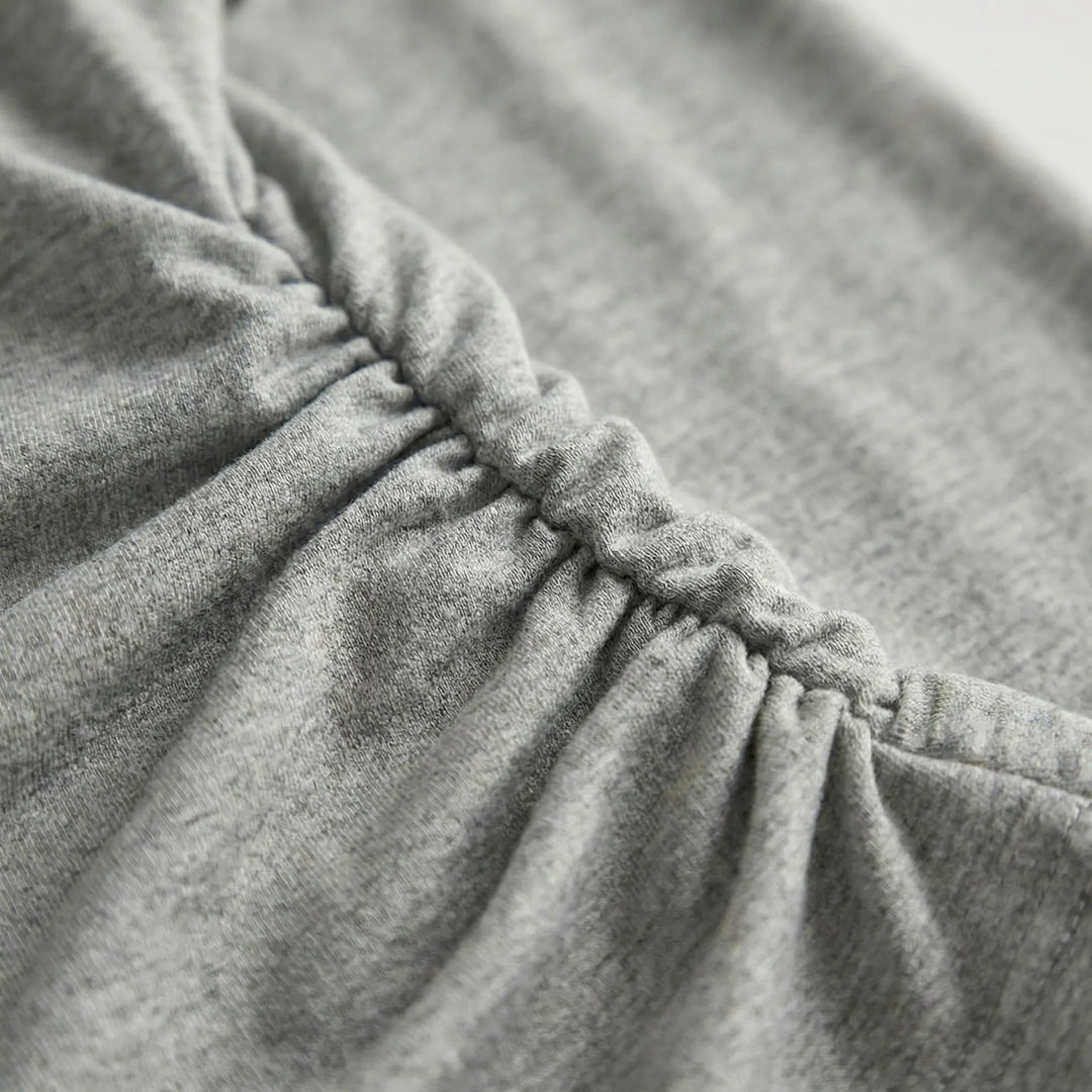 Elegant pleated ruched long-sleeve top for women. Versatile pull-on style, everyday comfort & flexibility.