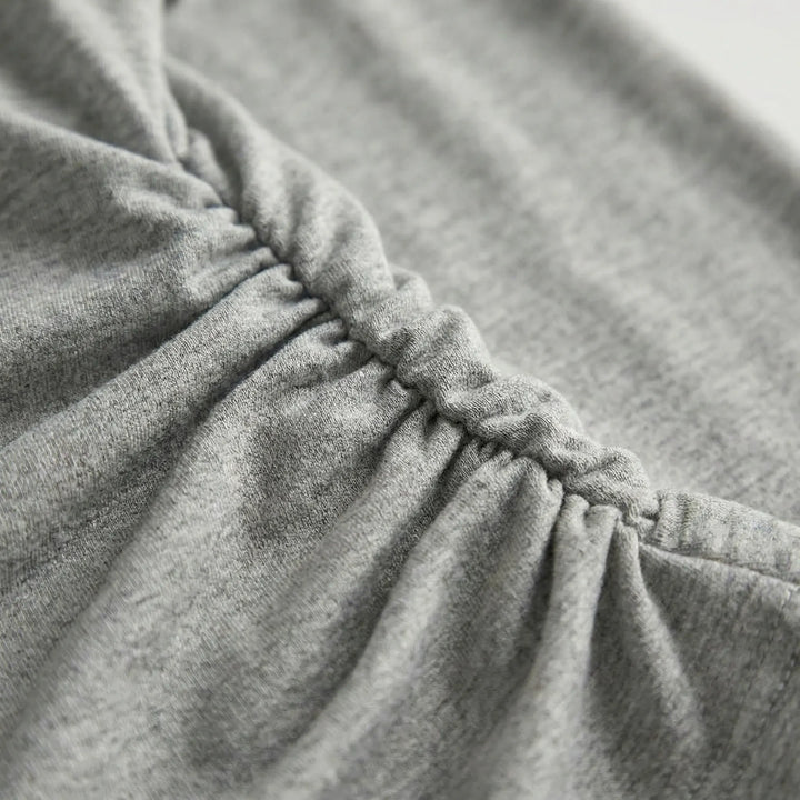Elegant pleated ruched long-sleeve top for women. Versatile pull-on style, everyday comfort & flexibility.