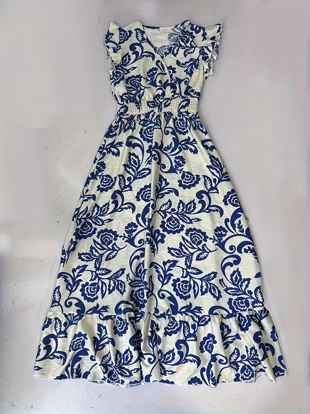 Women's casual yet elegant maxi dress, V-neck, ruffle cap sleeves, smocked waist, perfect for day or night.