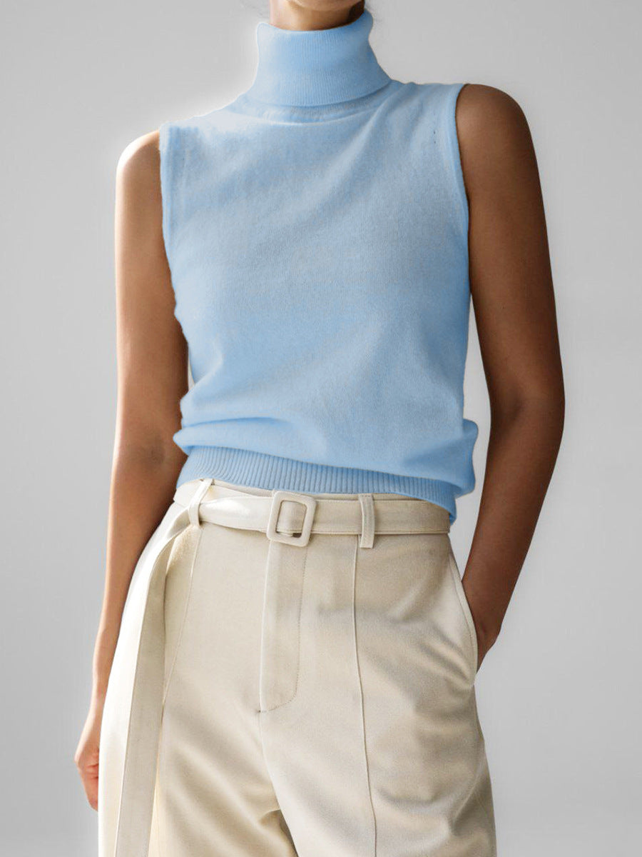 Women's sleeveless knit top with mock neck, easily transitions from casual to dressy.