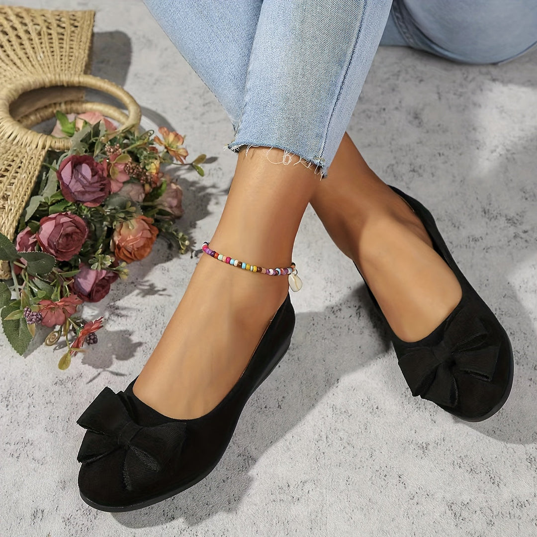 Stylish women's wedge shoes. Slip-on design with a pretty bow. Comfortable & versatile footwear.