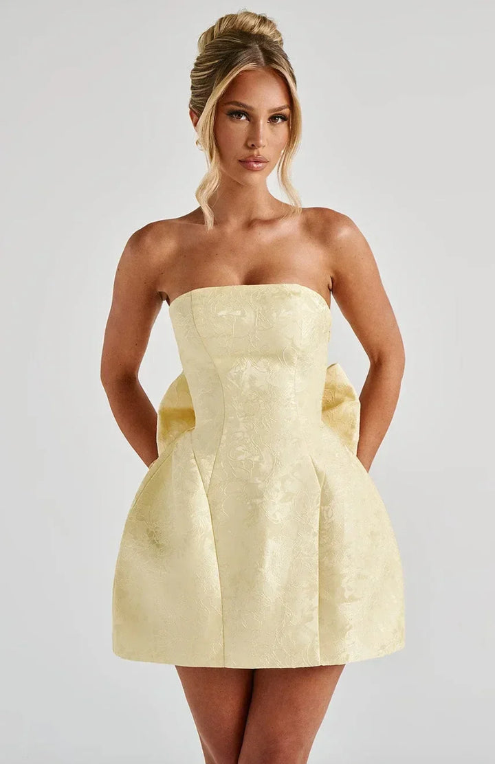 Women's elegant strapless mini dress with a chic bow back, perfect for parties & special occasions.