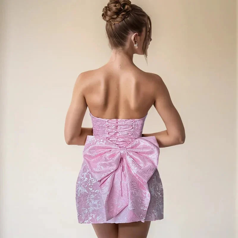 Glamorous red strapless mini party dress for women with elegant bow back. Stunning short cocktail dress.