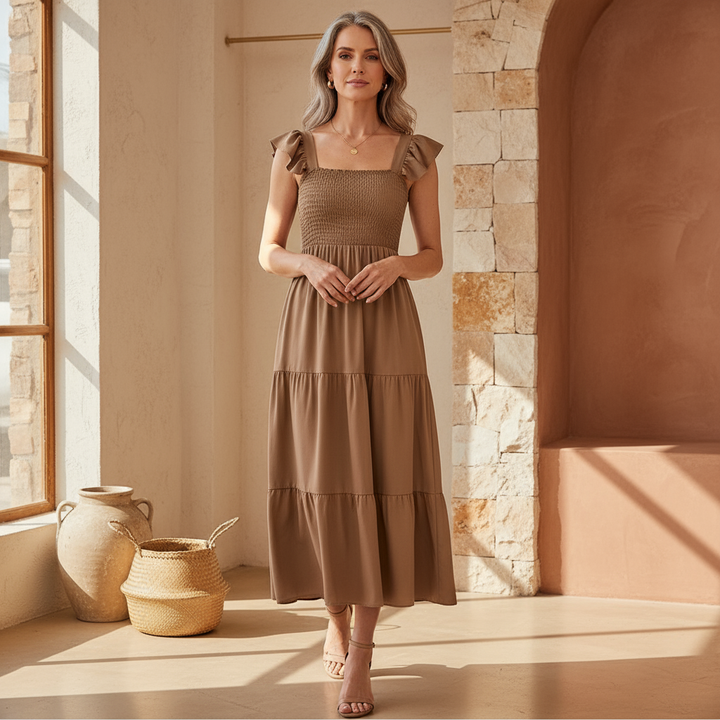 Women's elegant tiered midi dress with flowy fabric, perfect for summer casual or parties.