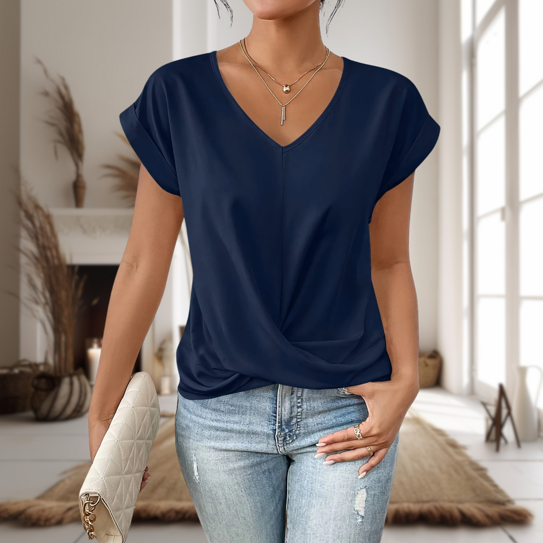 Chic women's V-neck blouse with a unique twisted hem, ideal for stylish summer outfits and casual wear.