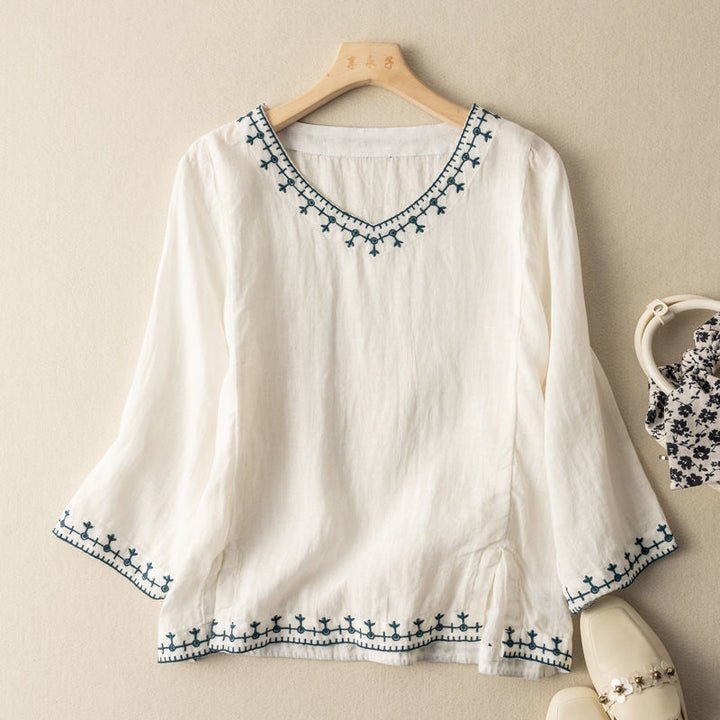 Women's elegant V-neck blouse with intricate pattern & short sleeves. Perfect for chic summer & spring daily wear.