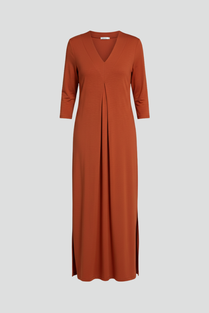 Woman confidently wearing a V-neck maxi dress, accentuating the elegant side slit and flowy silhouette.