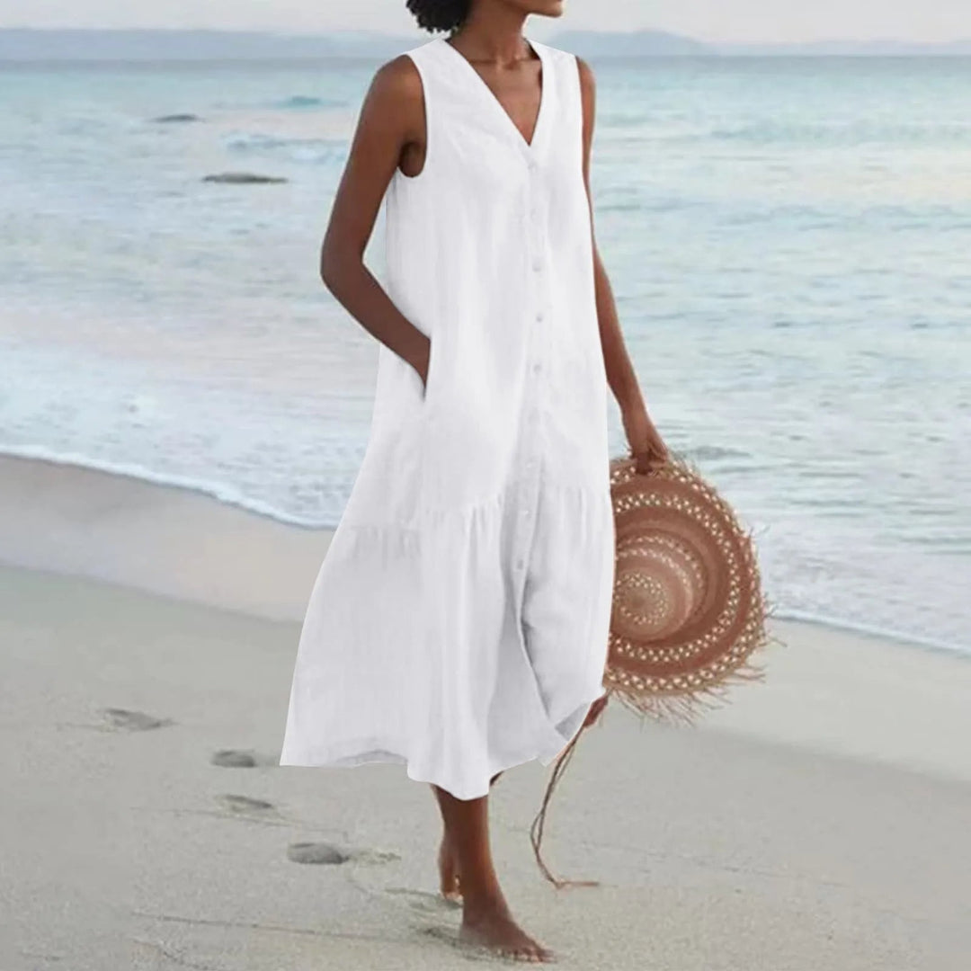 Women's elegant V-neck midi sundress with button front, perfect for casual summer wear or a beach vacation.