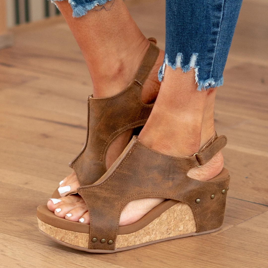 Modern women's elegant wedge sandals, ideal for chic summer outfits & comfortable walking.