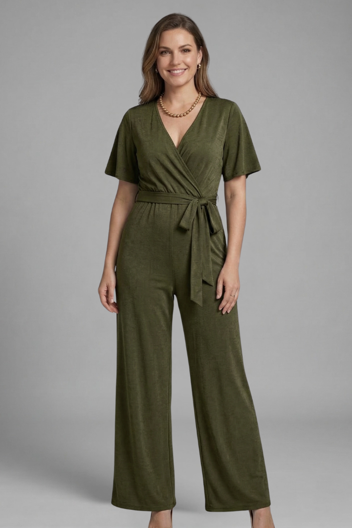 Modern women's wrap front jumpsuit with a stylish tie waist, offering a flattering and elegant silhouette.
