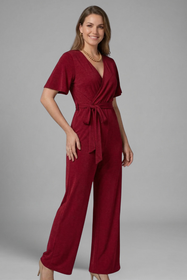 Chic women's formal jumpsuit with a flattering wrap front, practical tie waist, and comfortable wide leg.