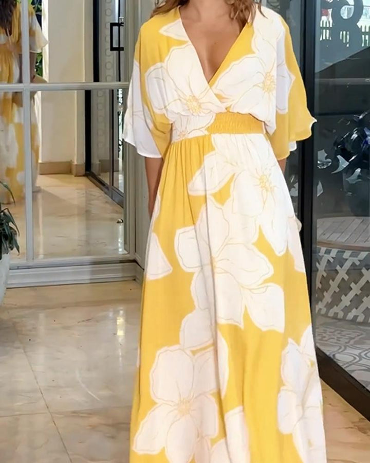 Flowy women's floral maxi dress with delicate flutter sleeves & V-neck, ideal for summer occasions & elegant events.