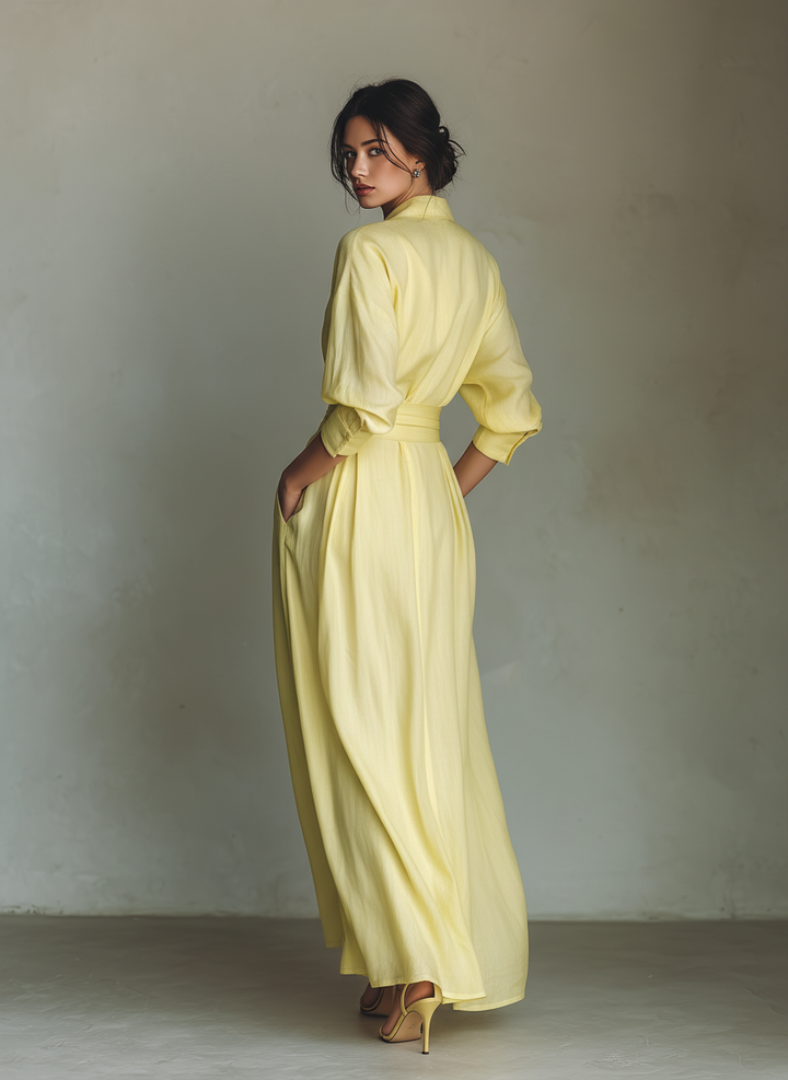 Stylish women's yellow maxi shirt dress. Elegant long casual design, perfect for summer and resort with tie-waist.