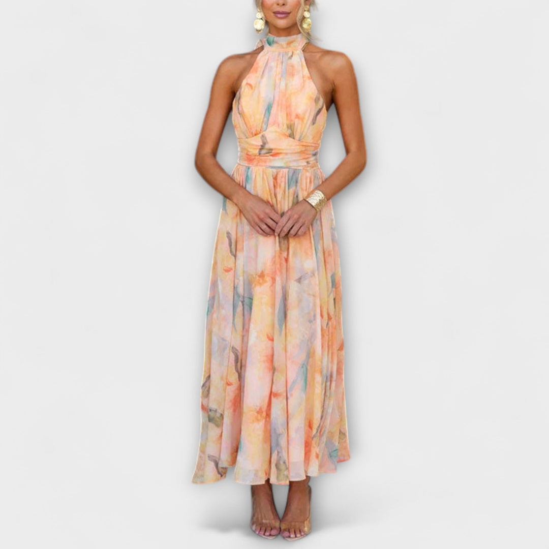 Women's Elowen Halter Maxi Dress with vibrant summer watercolor print, perfect for beach or vacation.