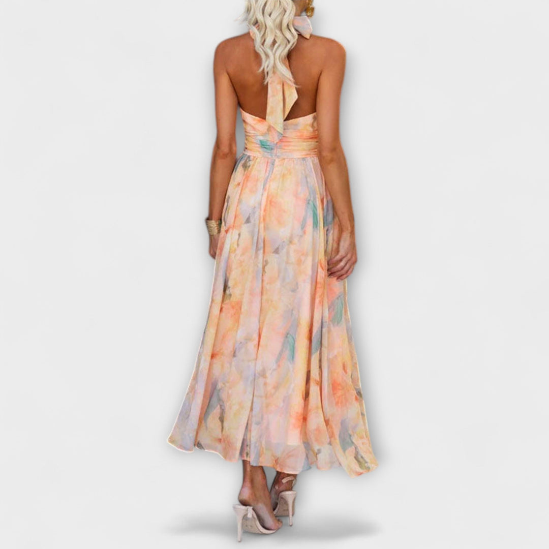 Elegant women's halter maxi dress, flowy and sleeveless with an open back, ideal for summer parties.