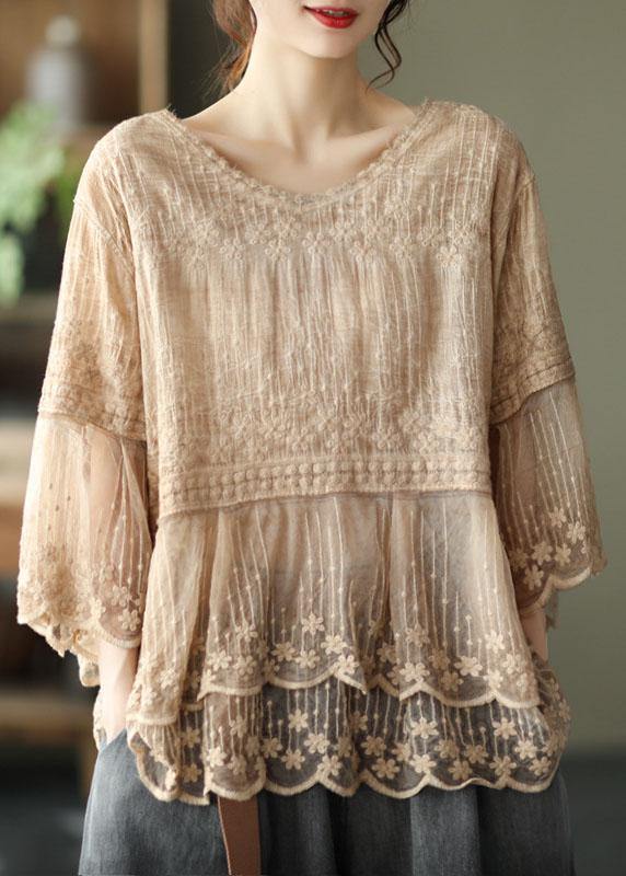 Bohemian style women's embroidered top featuring delicate floral patterns and a relaxed fit, perfect for casual elegance.