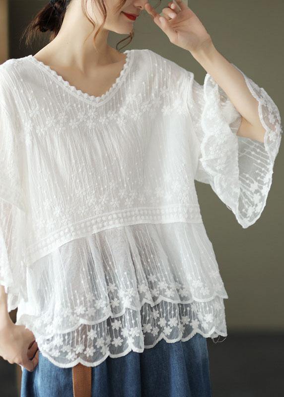 Lightweight women's blouse with a scoop neck, intricate floral embroidery, tiered lace hem, and comfortable half sleeves.