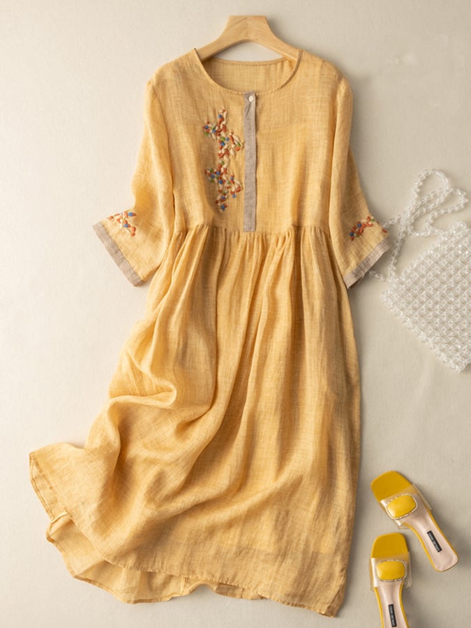 Women's embroidered loose fit midi dress with round neck and mid sleeves, perfect for casual summer fashion.