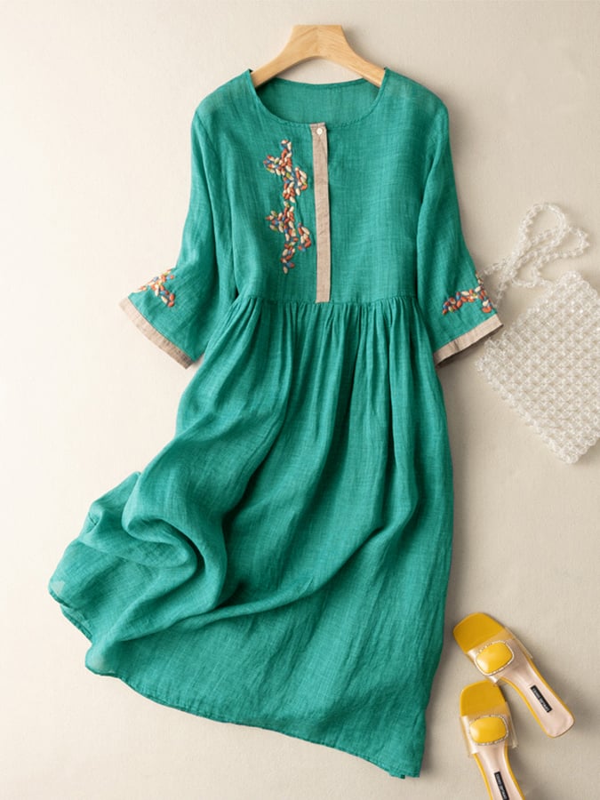Comfortable women's boho style embroidered midi dress, loose fit with mid sleeves, versatile for summer.