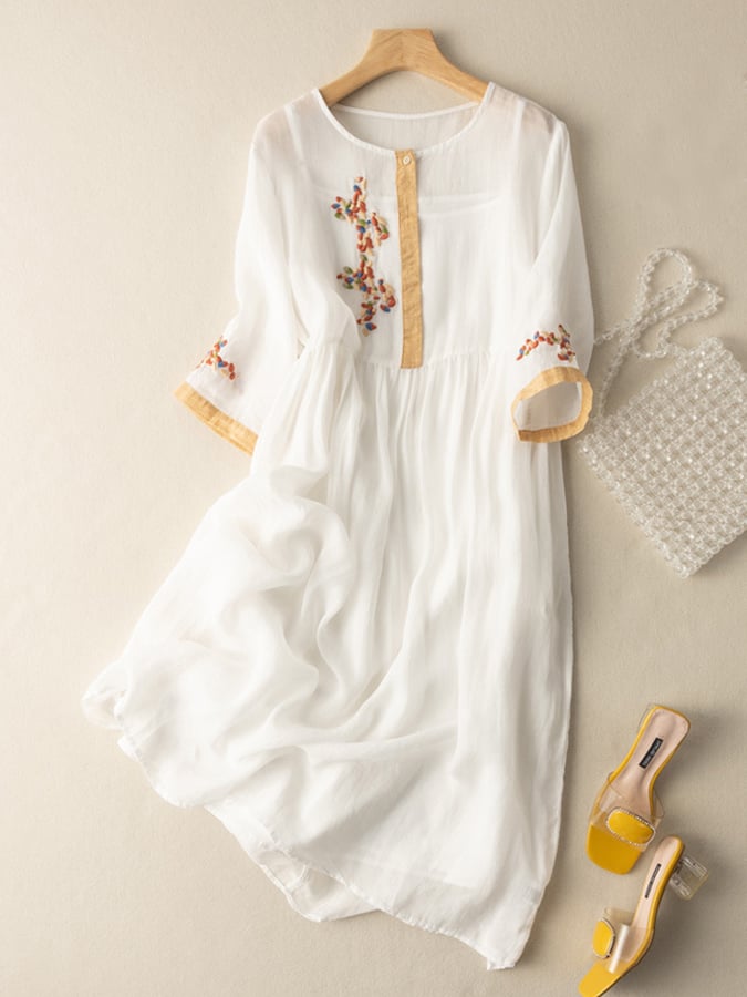 Elegant women's midi dress, loose fit with intricate embroidery, round neck, and mid sleeves for casual chic.