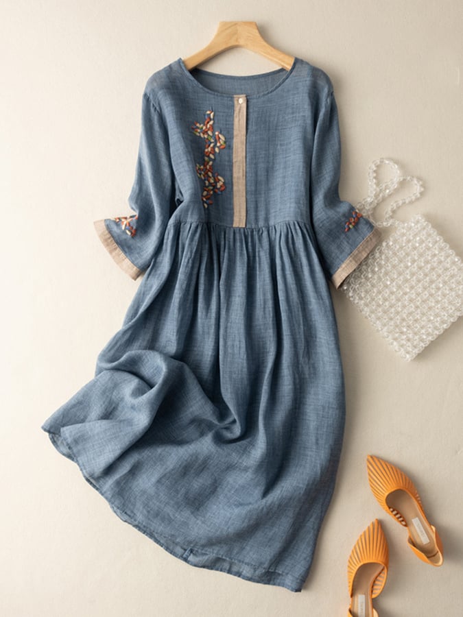 Flowy women's embroidered midi dress, loose fit, mid sleeves, and round neck for comfortable summer style.