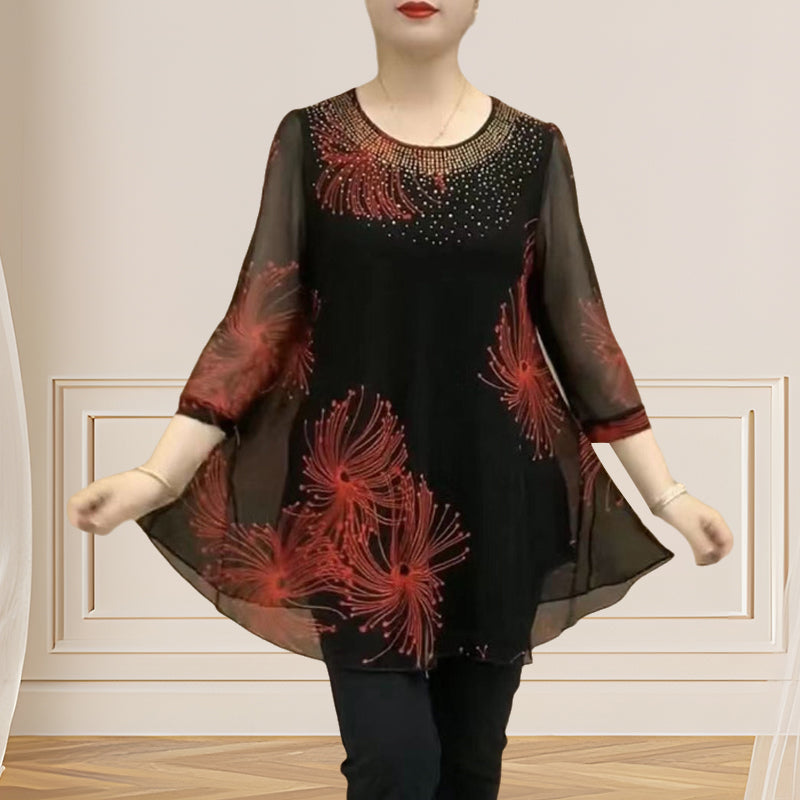 Detail of the sheer mesh fabric and embroidery on a women's round neck t-shirt