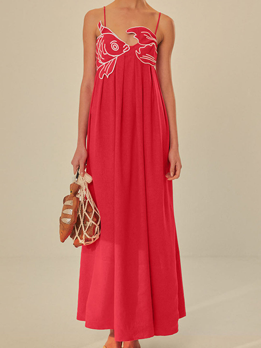 Women's embroidered spaghetti strap maxi dress in a flowing summer style for casual wear.